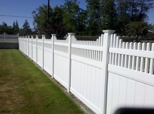 Vinyl Privacy Fence with New England Picket Accent installed @ our warehouse at 6908 Central Park Drive