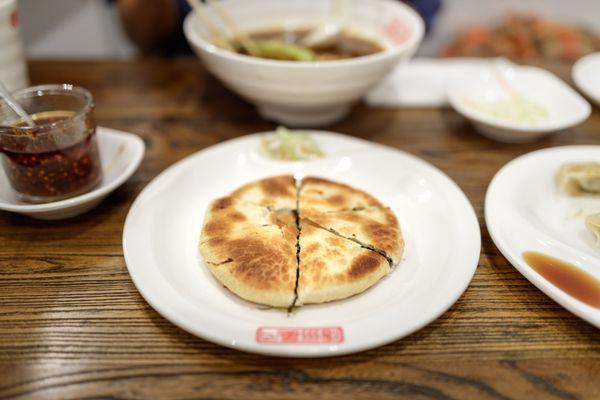 Wenzhou Style Stuffed Pita (Dried Vegetables, Green Onions, Ground Pork) $5.99