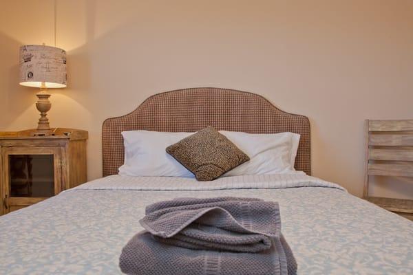 The queen bed in the guest bedroom at the Austin Westminster.