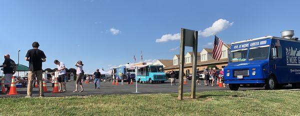 Some of the trucks and the fire department in the background