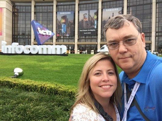 Husband and wife at audio visual tradeshow.