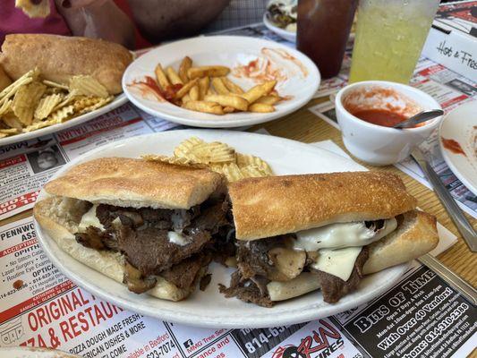 Cheesesteak with mushrooms. Meal comes with chips.