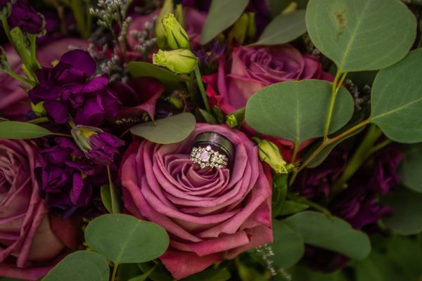 A close up of our flowers with our rings.