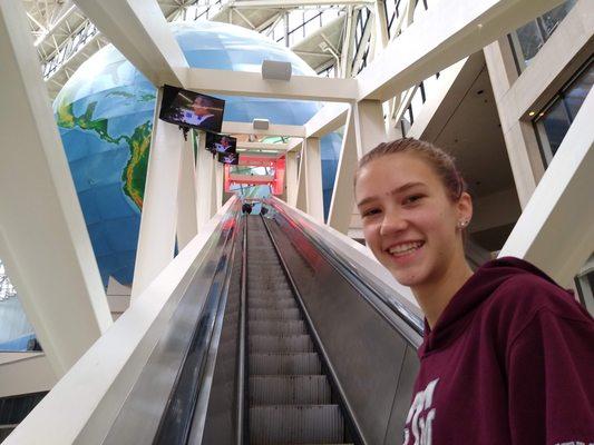 Riding up the world's longest freestanding escalator.