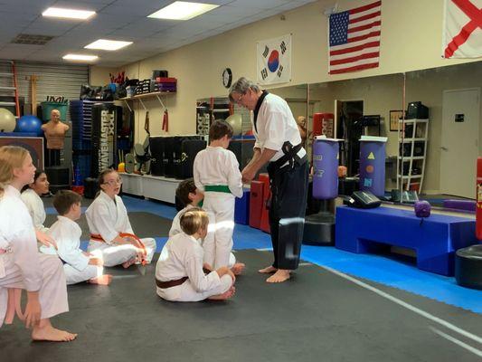 Rewarding with an earned stripe for skill demonstration.