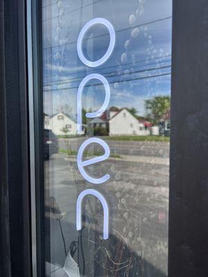 Sign says open , doors locked lights off