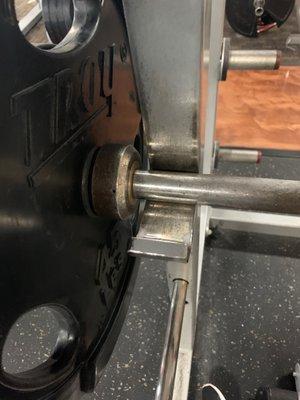 This is the most clearance you can get between the weights on the bar and the rack.