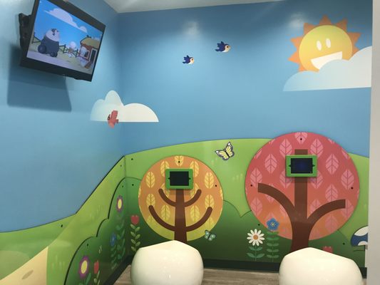 Kids can use our tablets or watch TV in our playroom during the short wait while parent's check in.