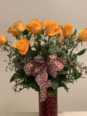 Premium Long stem Roses, Guinea, and Salal in a glass Vase