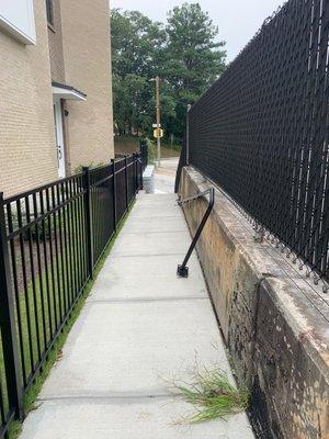 Hand rail has been down for months. Weeds growing everywhere