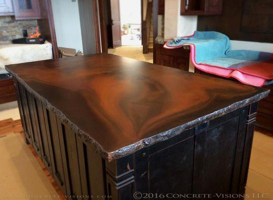 Color and style options are almost endless when working with concrete! This beautiful counter features an acid stain finish & chiseled edge.