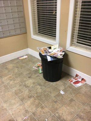 Mail room trash can is consistently left overflowing.