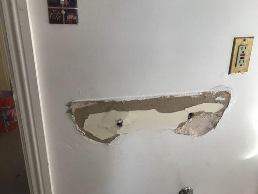 Wall damaged by "Roberts Flooring". I was unable to hang a new sink and had to cut a much bigger hole and repair...