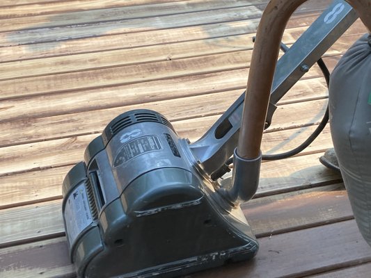 Sanding floorboards