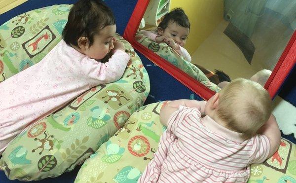 Just checking ourselves out in the mirror while talking about tummy time!