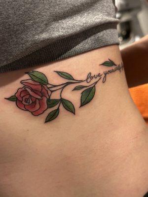 Love yourself first rose rib tattoo