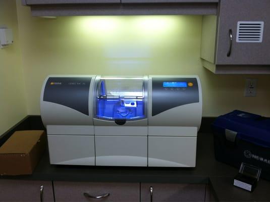 CEREC unit which makes crowns and other dental restorations in the office while you wait. The entire process is about an hour.