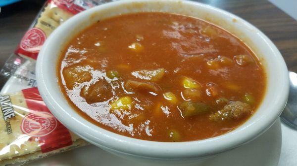 Cup of beef and veggie soup