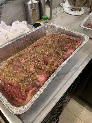 Prepping the New York strip to go in the pizza oven