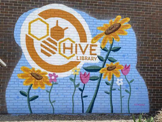 HIVE Library's new look! Mural 1 of 2 showing new logo as the transition from Pleasanton Lincoln Library to HIVE Library begins.