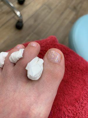 Pedicure with basic glitter polish