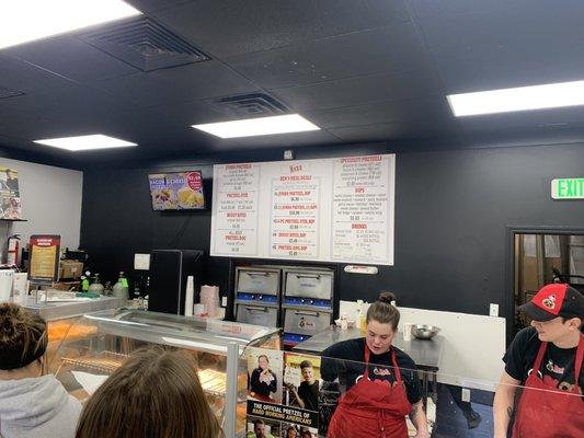 Menu board and busy staff