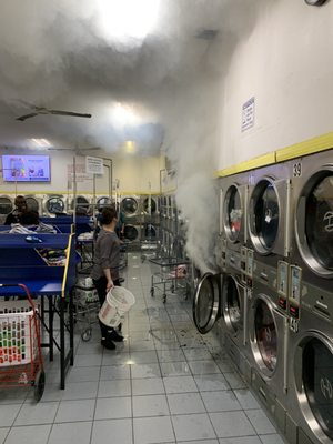 Owner putting out fire at the laundromat