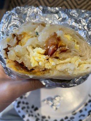 Breakfast burrito with potato, egg, cheese, bacon