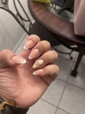 Almond nails with thin French tip and floral design