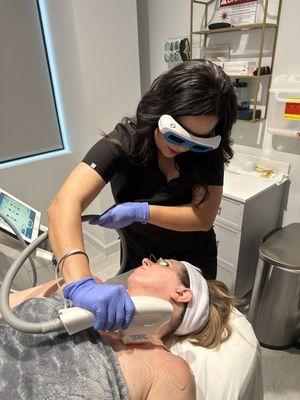 Ariana performing a BBL laser treatment