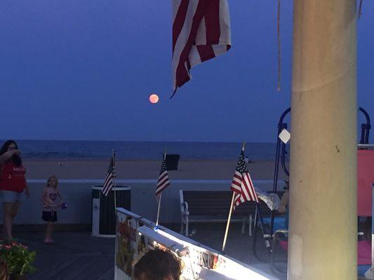 Beautiful full moon over the ocean on 4th of July.