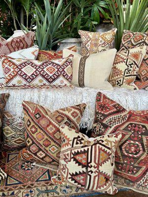 A collection of pillows made from vintage Turkish kilims.