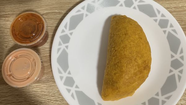 Beef empanada with spicy salsa and ketchup mayo ($2.50)