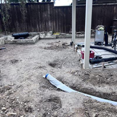 Backyard make over, French drains being installed for new repurposed turf grass.