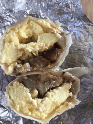 Breakfast burrito - Potato and eggs served with salsa and queso amarillo.