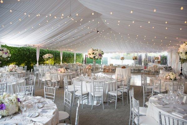 A tented wedding in the parking lot. @richprughphotography