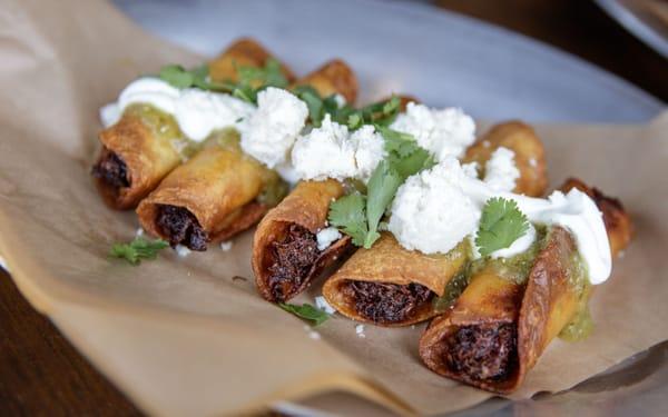 Duck Taquitos $12 "w/ salsa verde, sour cream, cotija cheese"