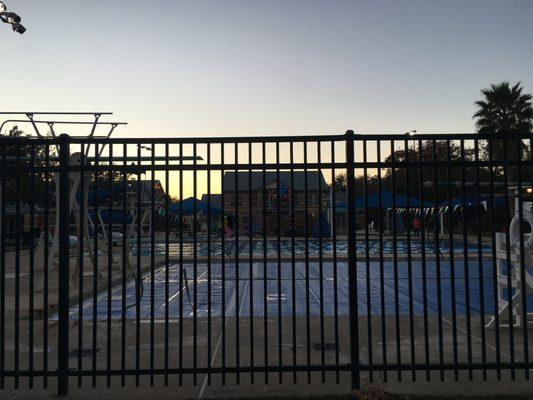 Aquatic center at sunset. Some swimmers even in December.