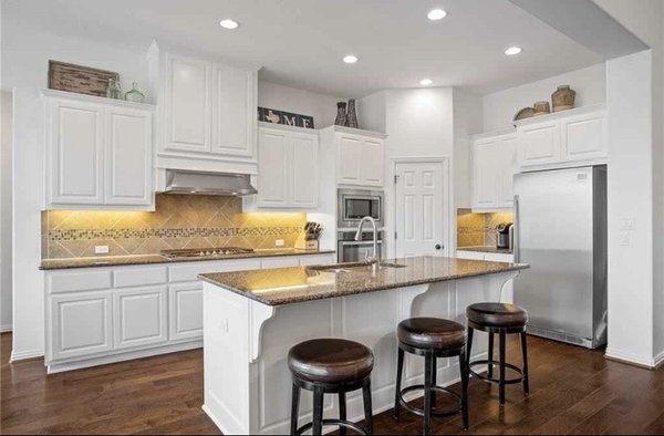 Knotty pine cabinets painted white