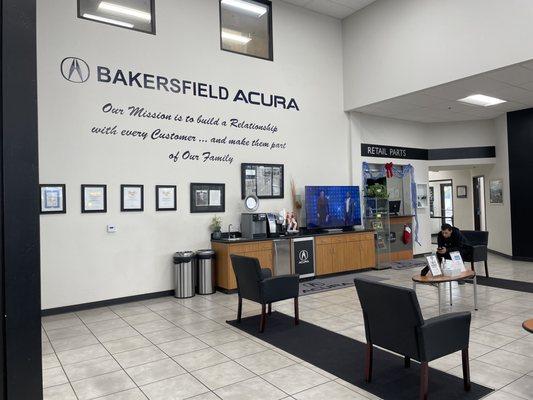 Multiple sanitary cans, coffee machine, water, lots of space between customers. Clean waiting area