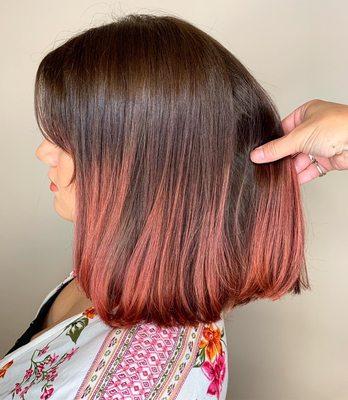 Coral balayaged bob with the cutest curtain bangs