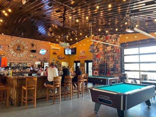 Bar area. 2 pool tables. And 2 dart boards.