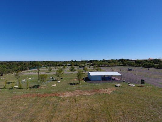 Dog Park on Left, Pavilion and Laundromat on right.  Green Grass Year Round