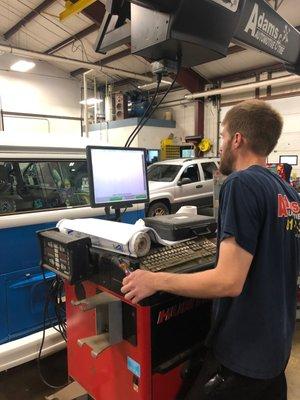 Ryan performing a wheel alignment