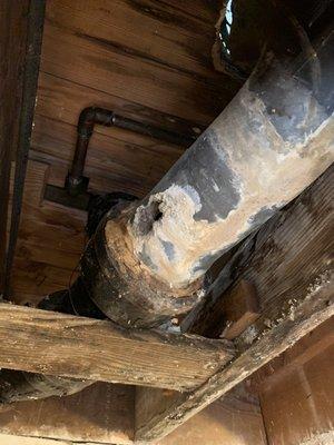 Lead soil pipe rotted a hole and leaked through ceiling