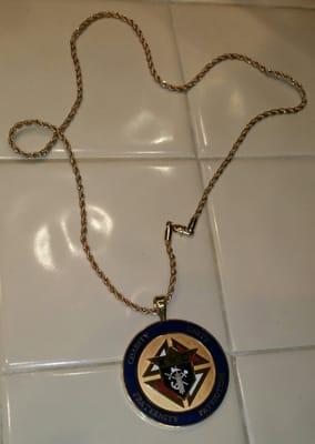 The AFTER  view of the same KofC challenge coin to which Francisco had attached my chain.