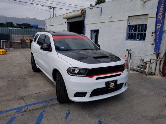 Gloss black roof and hood wrap with red winshield banner installed.