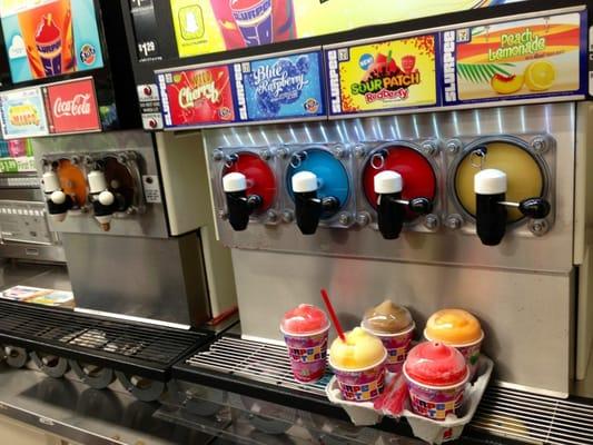 slurpee flavors... & i walked in on the annual free slurpee day!...y?...cuz it's 7-11...get it??...sure took me a minute, duh...