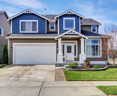 Legendary Transformation with new roof and siding installation.