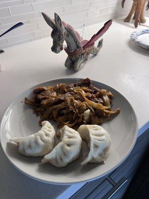 Beef chow fun and pot stickers, DELICIOUS! Yes that dragon truly resides on my counter. He isn't there just for the pic lol